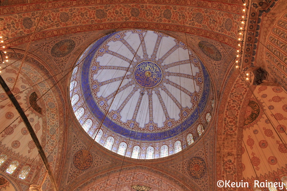 The grand interior dome of the Blue Mosque